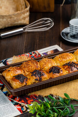 bolen pisang or Chocolate Banana Wrapped with Puff Pastry is Indonesian baked bread pastry with crust layers similar to those of croissant, baked flour with margarine  filled with chocolate and banana