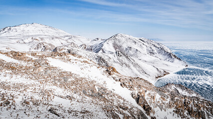 Snow-covered rocks of the Baikal coast