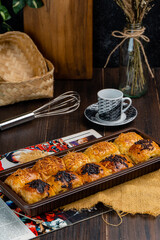 bolen pisang or Chocolate Banana Wrapped with Puff Pastry is Indonesian baked bread pastry with crust layers similar to those of croissant, baked flour with margarine  filled with chocolate and banana