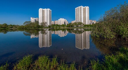 Reflection of houses in the pond water