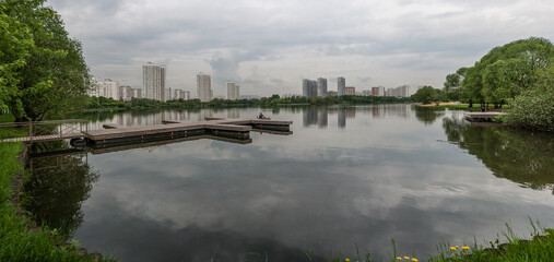 On the water of the city pond pontoon
