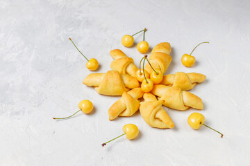 Homemade cookies with sweet yellow cherries.