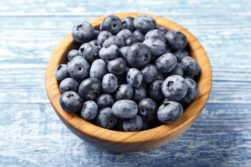 Freshly picked blueberries in a wooden bowl. Healthy berry, organic food, antioxidant, vitamin