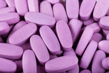 Obraz na płótnie Canvas Pills scattered as a background. Global health care concept. Antibiotics drug resistance.