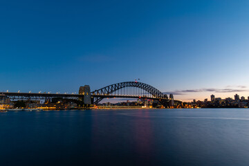 Naklejka na ściany i meble Dawn view of Sydney Harbour Bridge with clear sky.