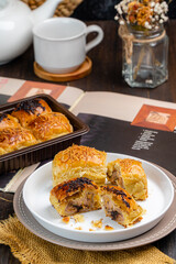 bolen pisang or Chocolate Banana Wrapped with Puff Pastry is Indonesian baked bread pastry with crust layers similar to those of croissant, baked flour with margarine  filled with chocolate and banana