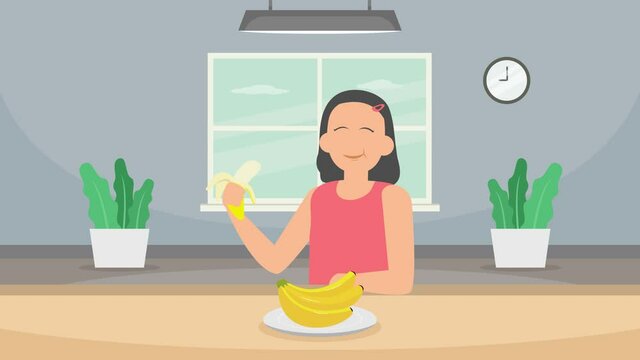 Happy woman eating banana at home