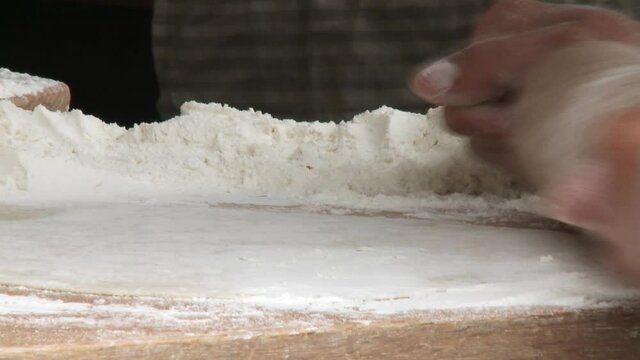 Baking bread old style on the event medieval week in the city of visby on the island Gotland in Sweden