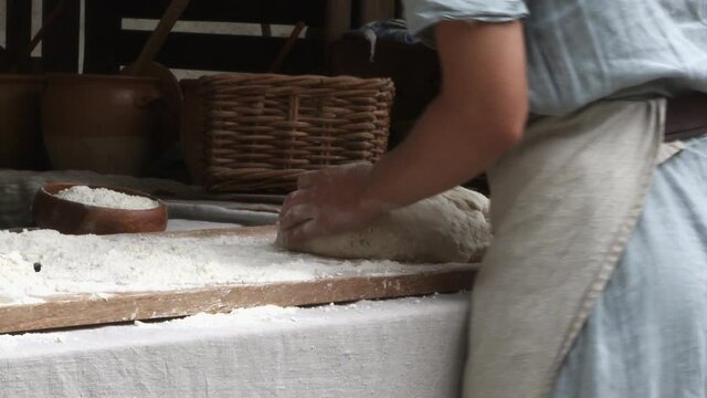 Baking bread old style on the event medieval week in the city of visby on the island Gotland in Sweden