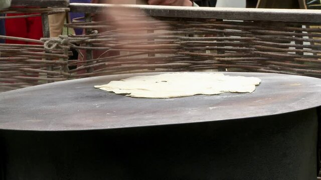 Baking bread old style on the event medieval week in the city of visby on the island Gotland in Sweden