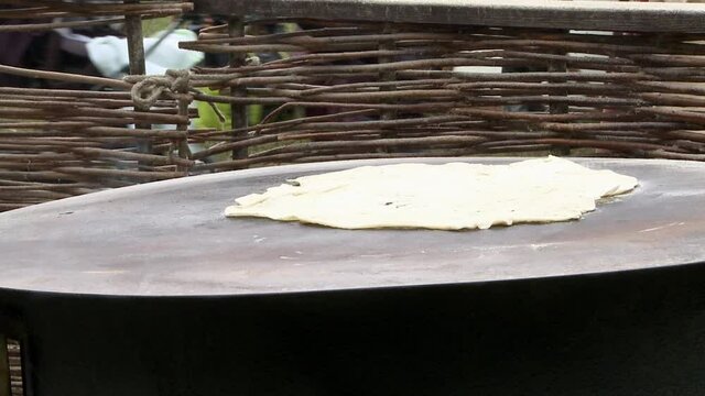 Baking bread old style on the event medieval week in the city of visby on the island Gotland in Sweden