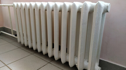 Indoor heating radiator. Cast iron radiators heat the room.