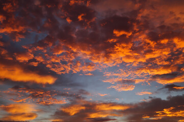 Fototapeta na wymiar scenic orange golden cloudscape at sunrise abstract background 