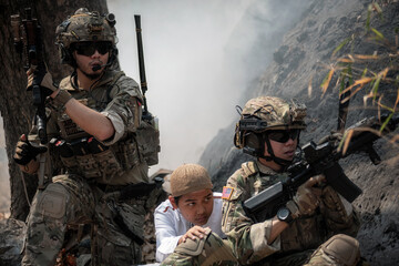 Soldiers are protecting child to be safe from war who are fighting in a border area. War, soldier...