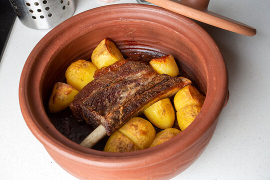 From traditional delicious Turkish food; potato and meat dish in casserole (Turkish name; Guvec tas kebabi, kaburga tandir)