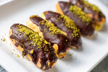 Traditional french eclairs with chocolate.