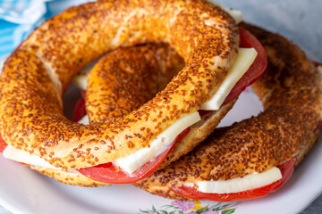 Traditional Turkish breakfast with Turkish bagel with cheese and tomatoes (Turkish name; simit or...