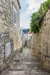 Picturesque old stone narrow street in Cavtat. Cavtat - coastal town in the southern Konavle region of Croatia, just 20 kilometers away from Dubrovnik.