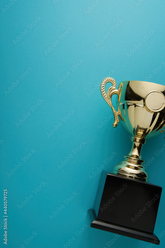 Poster golden trophy on blue background