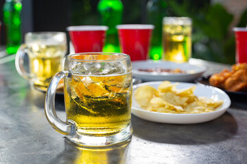Beer party with friends at home, International Beer Day concept.