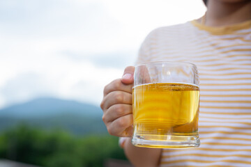 girl drinking beer celebrating on vacation