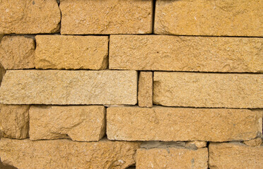 Yellow old grunge Brick Wall Vintage Stone Texture Background