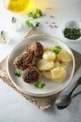 Homemade burgers with potato salad