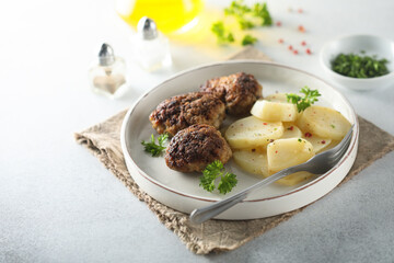 Homemade burgers with potato salad