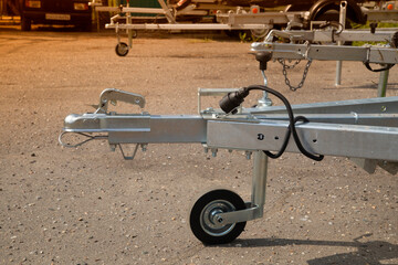 A store that sells trailers.Car open trailer. Transport for cargo transportation.