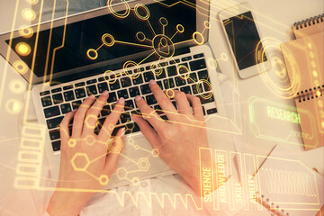 Double exposure of woman hands working on computer and data theme hologram drawing. Top View. Technology concept.