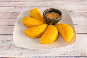Colombian corn empanadas with some sauce