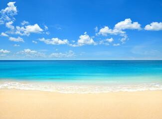 Fototapeta na wymiar Summer beach with blue sky and clouds background.