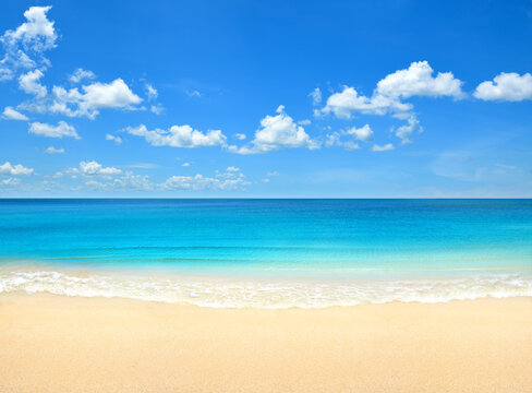 Summer beach with blue sky and clouds background.