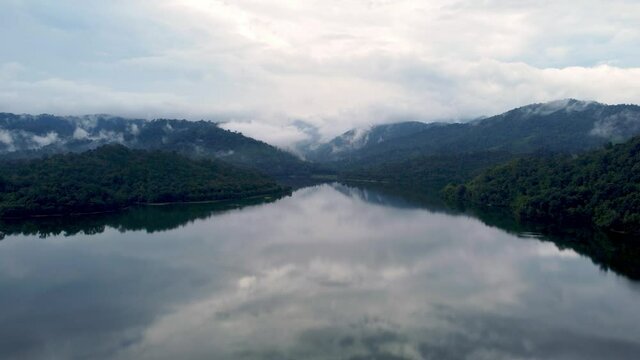 Move at beautiful reflection view of lake at Malaysia in cloudy day