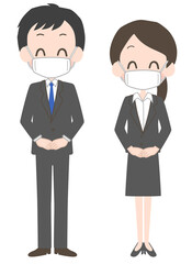 マスクを着けたスーツ姿の男女