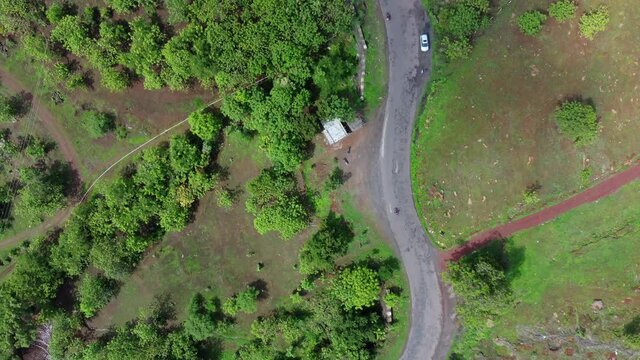 Aerial footage of a road with traffic at village Bhor near Pune India.
