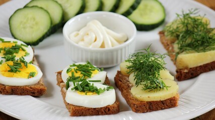 traditional danish open sandwich with egg, chives and popato, dill ( smørrebrød )