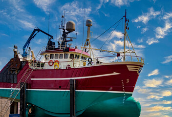 Fishing Boat in the repair yard for a Paint and Cleaner at Fraserburgh Harbour, Aberdeenshire,...