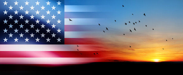 United States of America flag on bright sky at sunset or sunrise with flying birds background