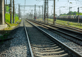 Obraz premium Railway tracks in the future. Train station near the city.