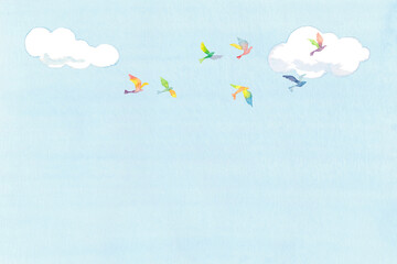 虹色の鳥の群れと青空