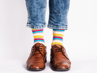 Men's legs, trendy shoes and bright socks. Close-up. Style, beauty and elegance concept