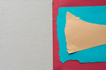 sand brown, blue, and red torn paper background with mill board