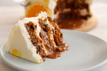Minimalistic single tier wedding cake with white icing and sliced orange and eucalyptus decoration. Close up, copy space for text, background, top view.