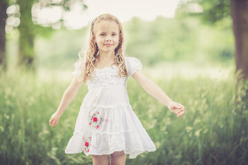 Fototapeta premium dreamy portrait of a young girl outdoor