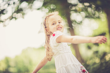 Fototapeta premium dreamy portrait of a young girl outdoor