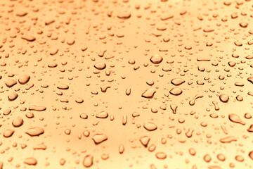 Many different drops of water on the metal surface