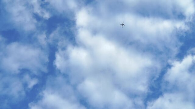 Flying airplane over blue sky and beautiful cloud
