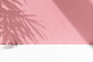 Minimal abstract background for the presentation of a cosmetic product. Premium podium with a shadow of tropical palm leaves on a pink wall. Pink wall and white table.