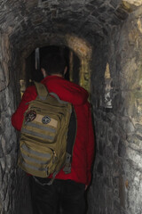 man in the dark tunnel of the castle